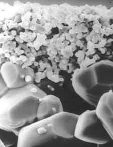 A scanning electron microscope image shows the two membrane layers of the filter element: ultrafine and fine (top to bottom)